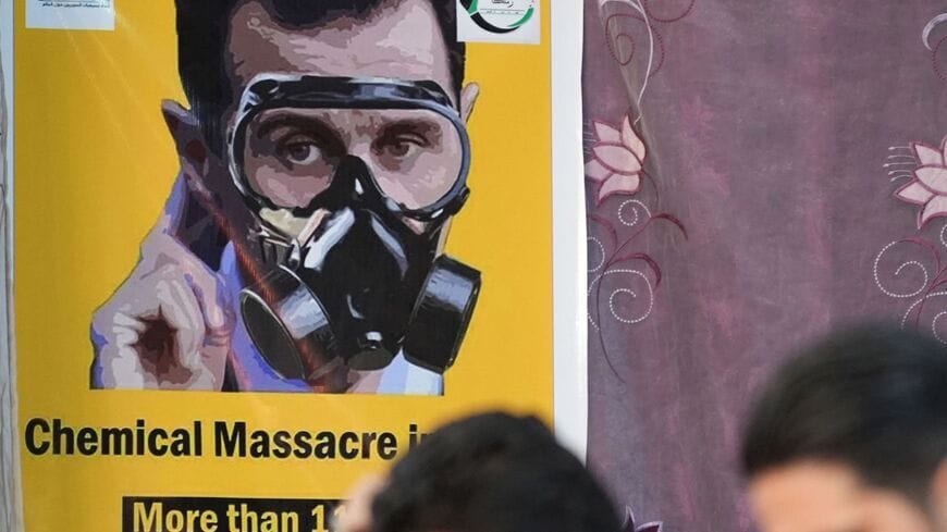 A poster commemorating chemical attacks by the government of Syrian President Bashar al-Assad on Ghouta in 2013. Photo Rami Al Sayed/AFP/Getty Images