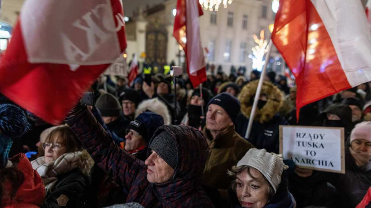 Supporters of Poland’s opposition PiS party demonstrate against the arrest of two MPs. Photo: Wojtek Radwanski/AFP