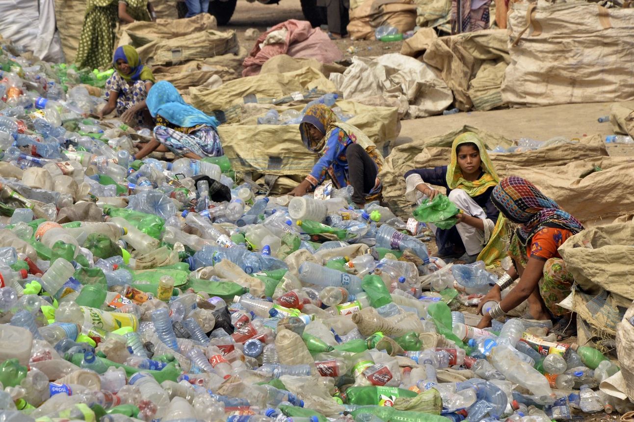 Laborers at a plastic recycling factory in Hyderabad, Pakistan. Photo: Pervez Masih/AP