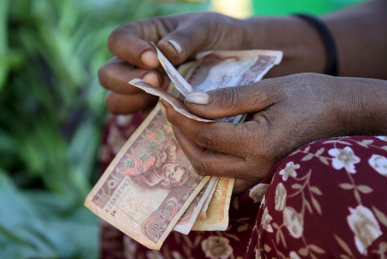 A woman counts Ethiopian birr notes at a market in Addis Ababa. File photo: Tiksa Negeri/Reuters