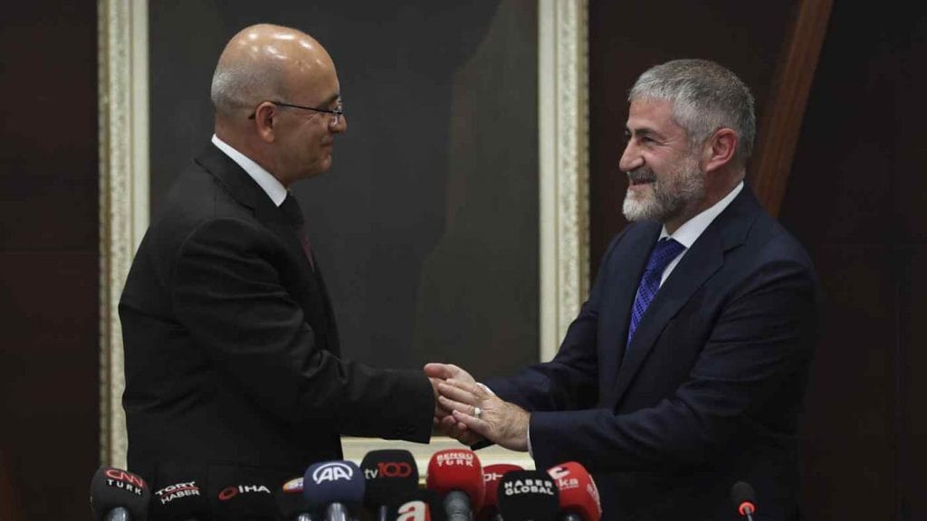 Finance minister Mehmet Şimşek, left, with his predecessor Nureddin Nebati at a handover ceremony in Ankara. Photo: Anadolu Agency/Getty Images