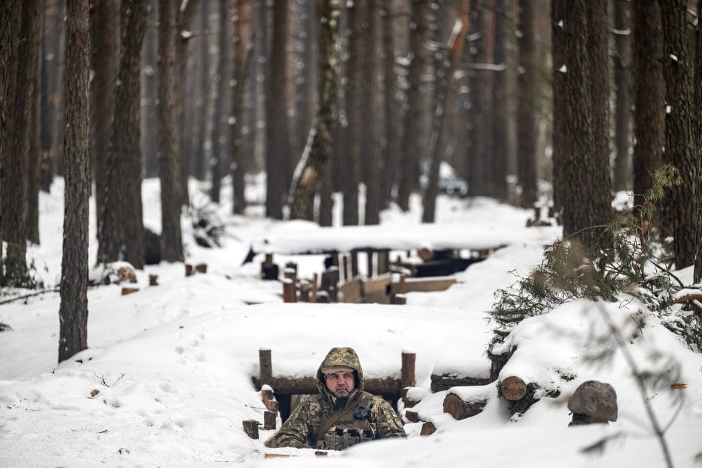 A Ukrainian soldier in a trench close to the Belarusian border. Photo: Lynsey Addario for The New York Times