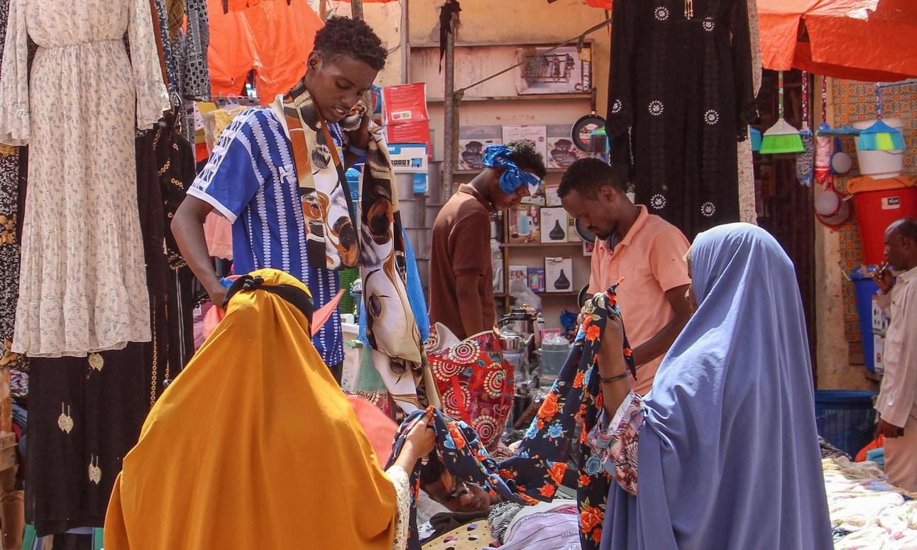 Women browse fabrics in a street market in Mogadishu, December 2023.&nbsp;Photo: Said Yusuf Warsame/EPA-EFE/Shutterstock