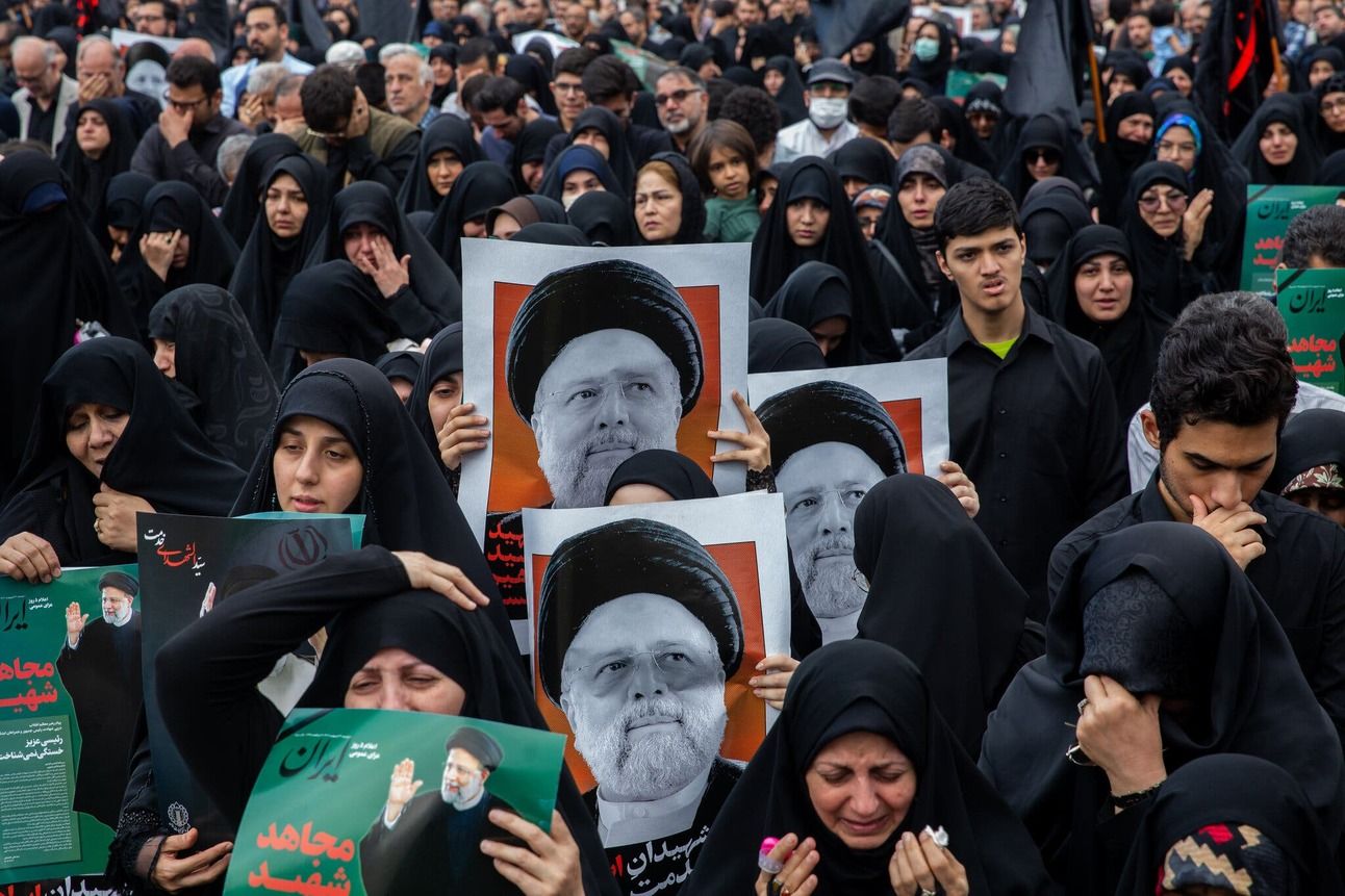 People gather in Tehran on Monday to pay their respects to the country’s president, foreign minister and other officials who died in a helicopter crash. Photo: Arash Khamooshi for The New York Times