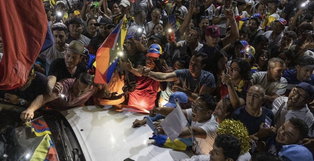 Supporters surrounded the car of opposition leader María Corina Machado in June. Photo: Fabiola Ferrero/Bloomberg
