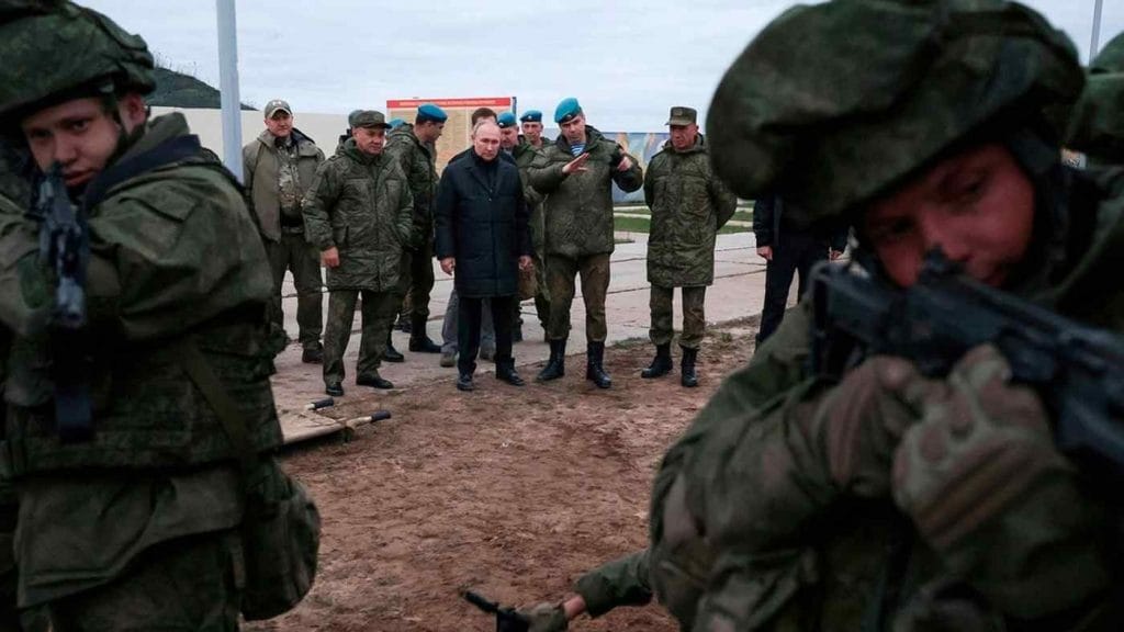 Russia’s Putin at a military training center for mobilized reservists. Photo: Russian Defense Ministry Press Service/AP