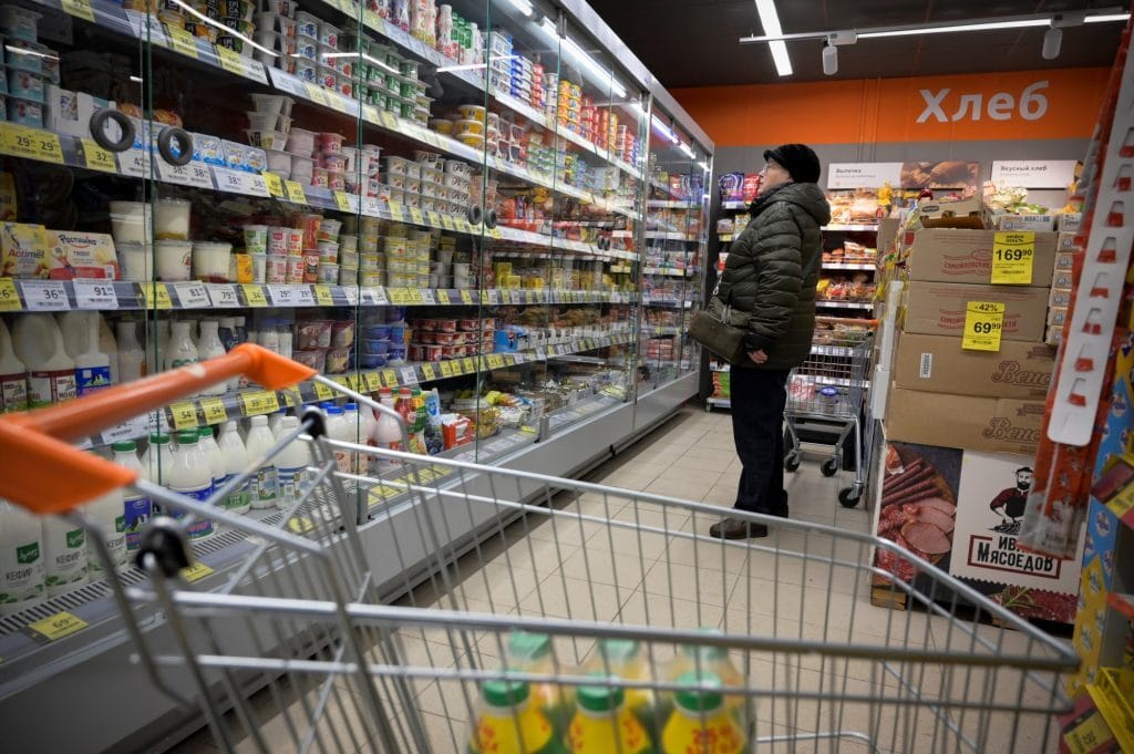 A woman shops at a supermarket in Moscow. Photo: Natalia Kolesnikova/AFP/Getty Images