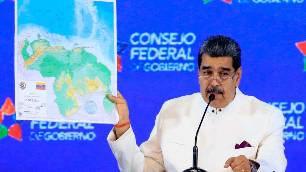 Venezuela President Nicolás Maduro with a maps showing Essequibo as part of Venezuela. Photo: Venezuelan Presidency