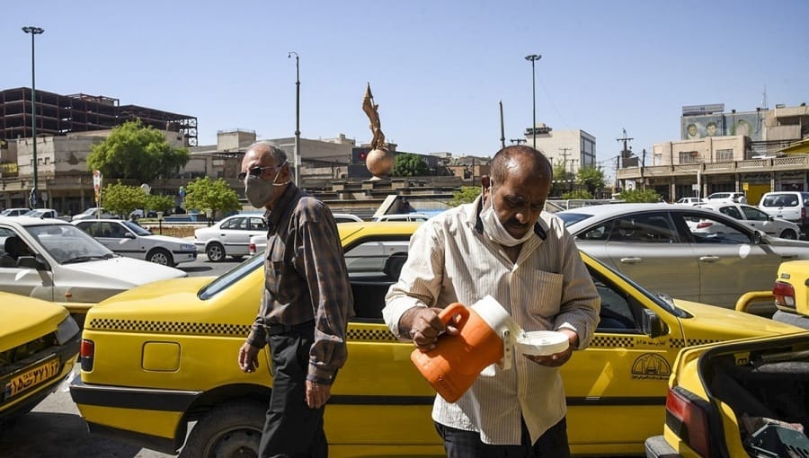 Iranians in Ahvaz try to combat the intense heat. Photo: Financial Tribune
