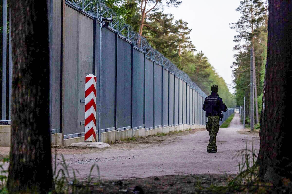 A guard patrols the Poland-Belarus border. Photo: Wojtek Radwanski/AFP/Getty Images