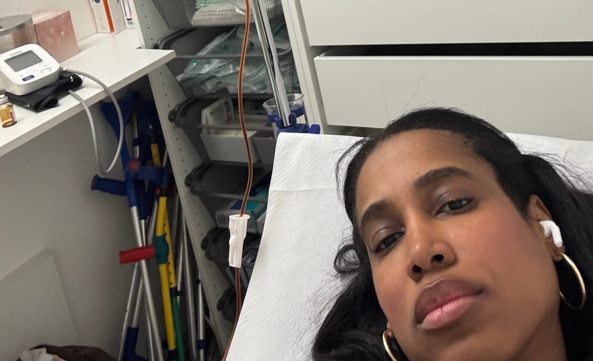Dafina lying back receiving an iron IV transfusion at Medi Verbier in Switzerland.
