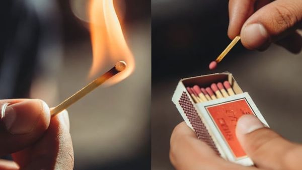 A lit match and taking an unused match from a matchbox.