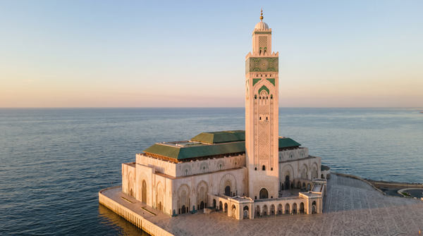 Hassan II Mosque in Casablanca at golden hour over the Atlantic Ocean