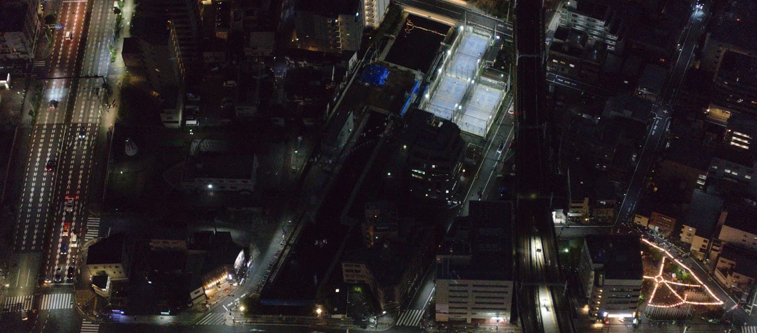 Aerial view of the city at night — N independently-owned, heterogeneous buildings