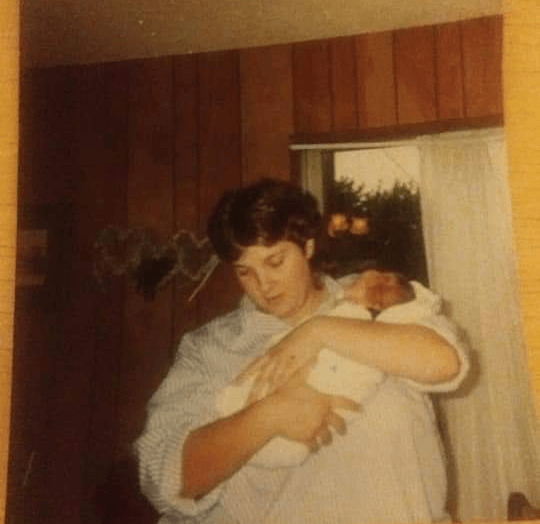 Angela Cook holds her son Tim Cook as an infant. 