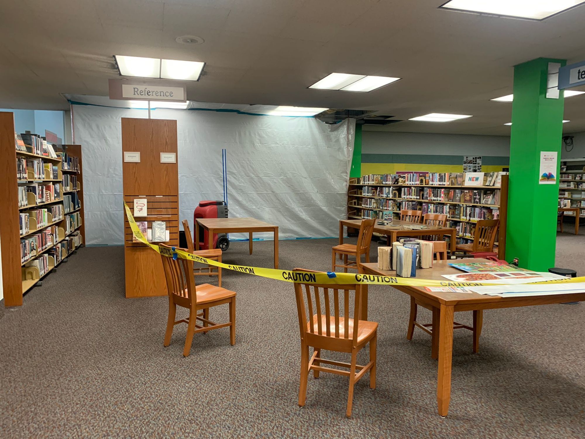 A plastic sheet covers a section of the John F. Kennedy Library in January following a fire. Photo: John Glidden.