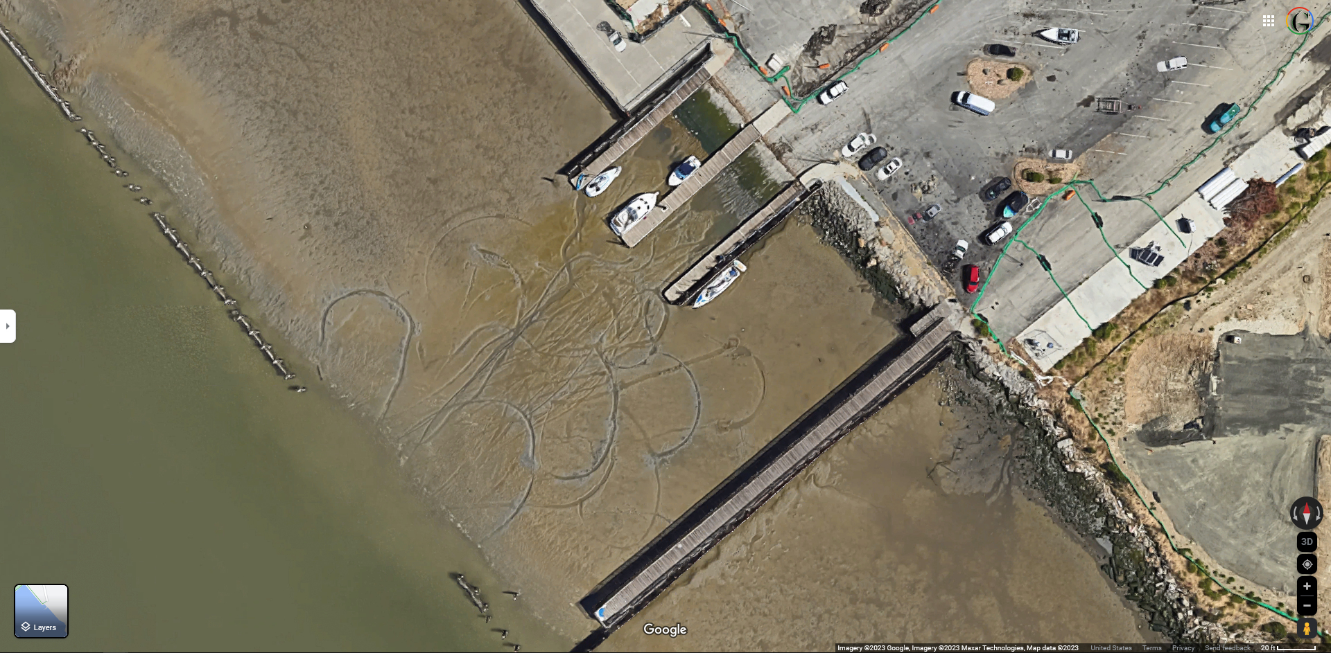 Screenshot of Google Maps shows Vallejo’s public boat launch at low tide. Boats making aborted docking attempts have left propeller gouges in the muck.