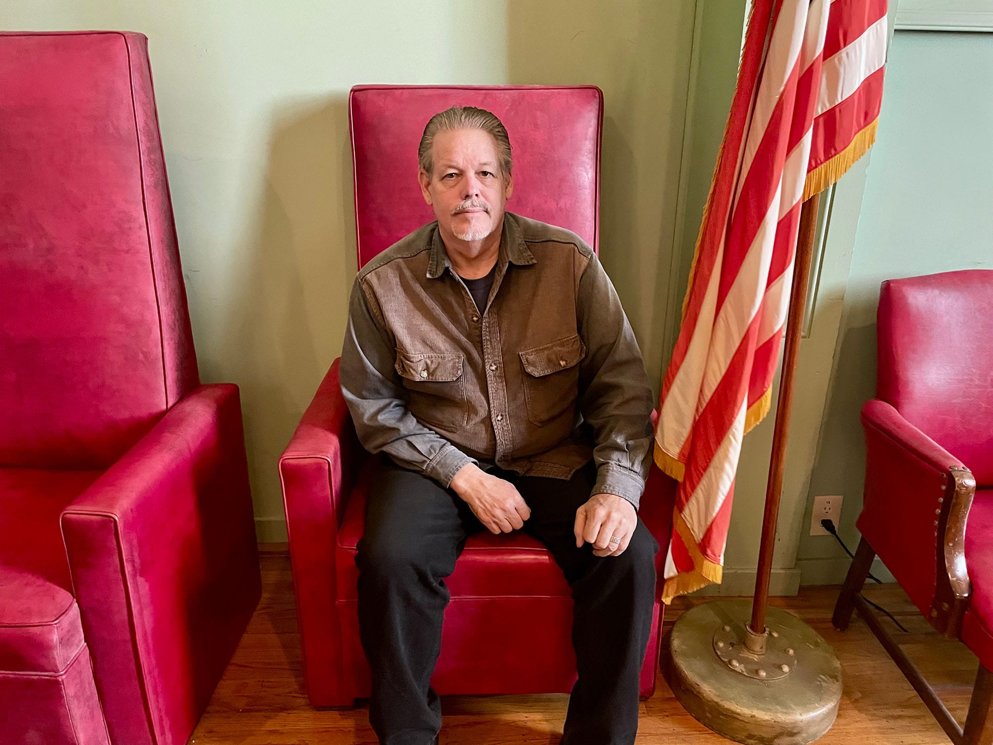 Odd Fellows historian Peter V. Sellars sits in the grand hall of the Vallejo lodge.