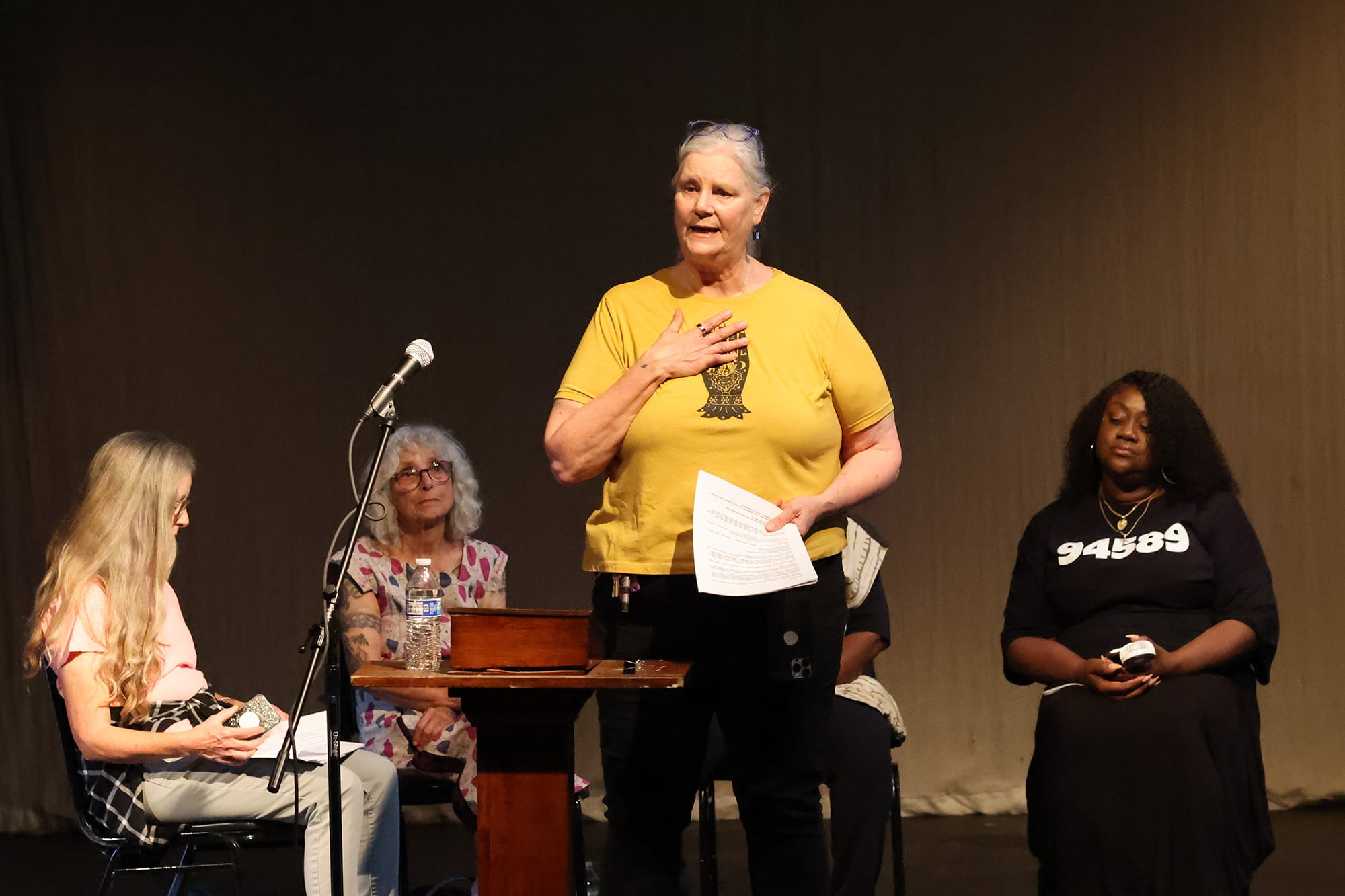 Mira Theatre Guild Board President Kat Cook speaks at a community forum on Sept. 11.