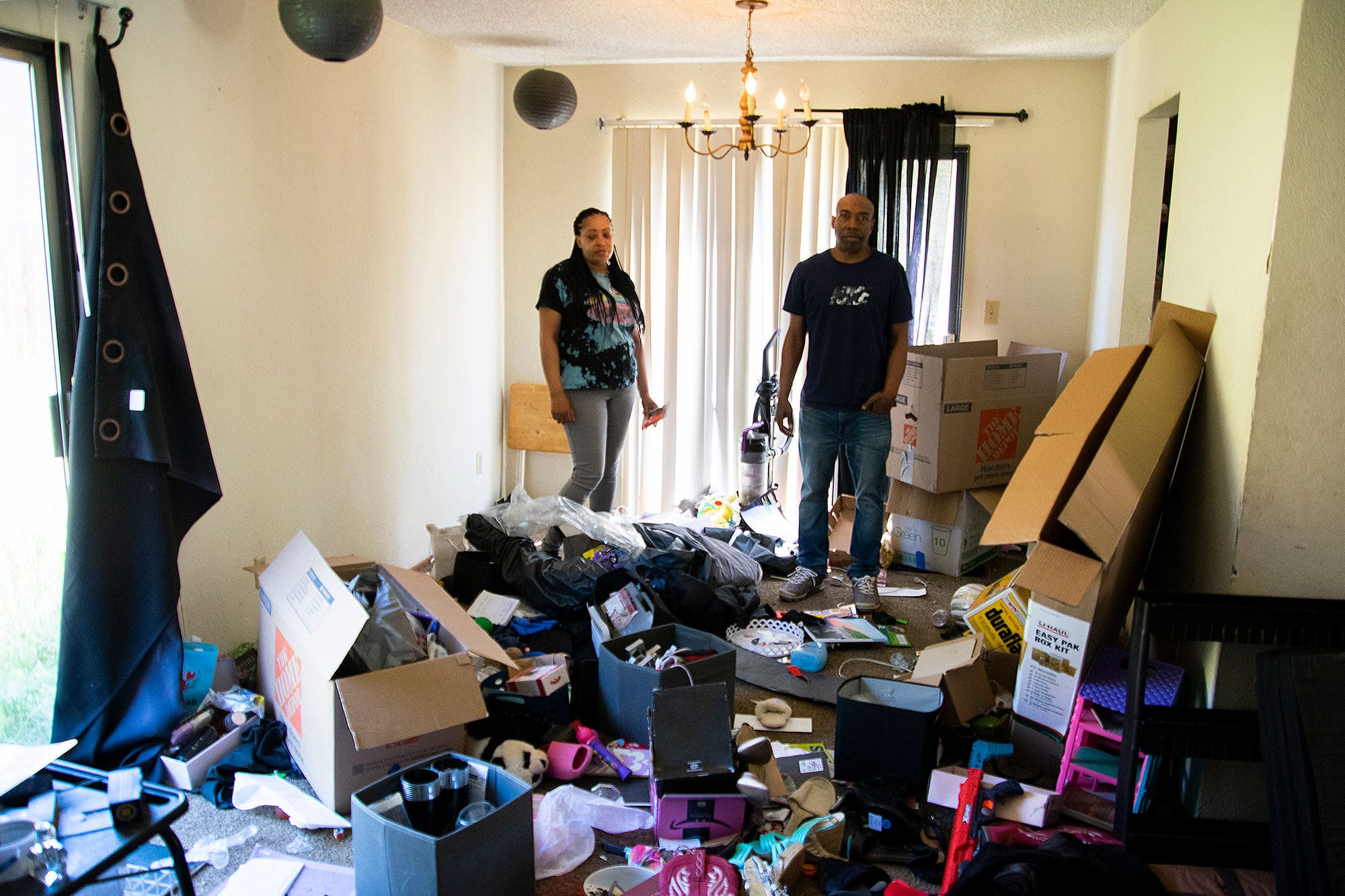 Kellyann and Jamal Colter stand in their living room after Vallejo police Sgt. Jodi Brown searched it last year. 