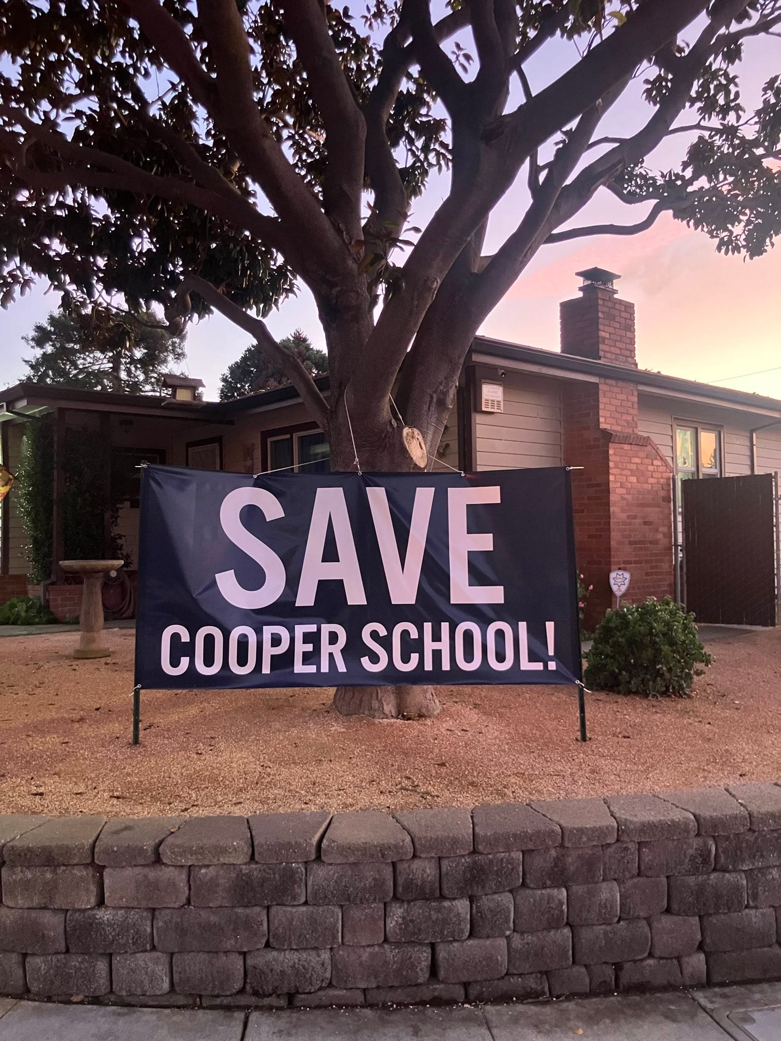 A sign at a home across the street from Cooper Elementary School.