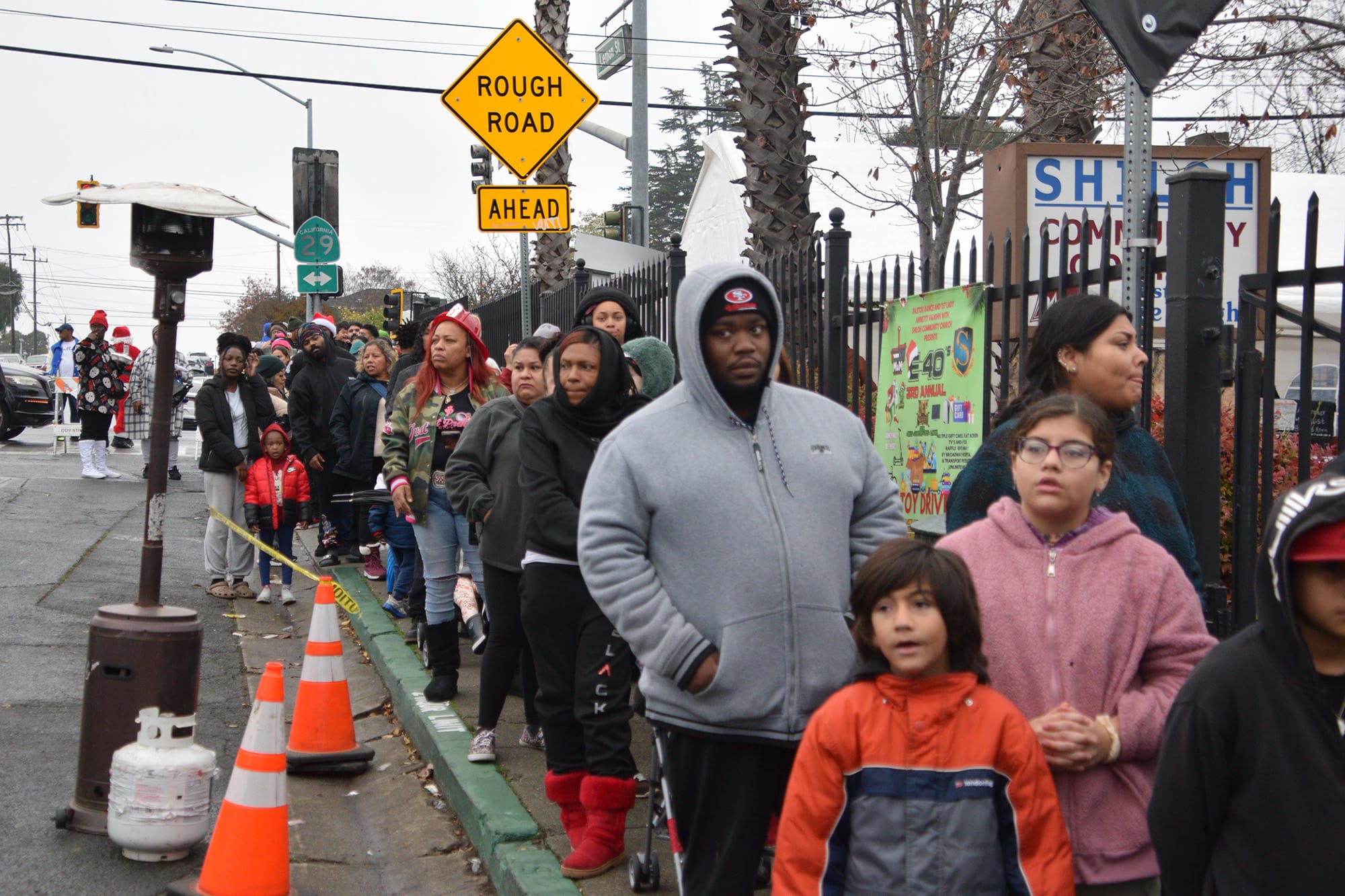 People lined up outside E-40's Toy Drive in South Vallejo on Saturday. 