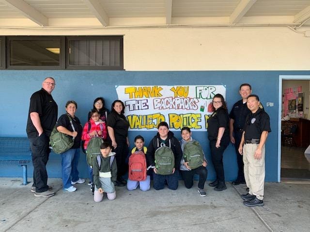 Vallejo police grant project reports frequently showed outreach with children, such as this backpack giveaway from a 2019 report. 