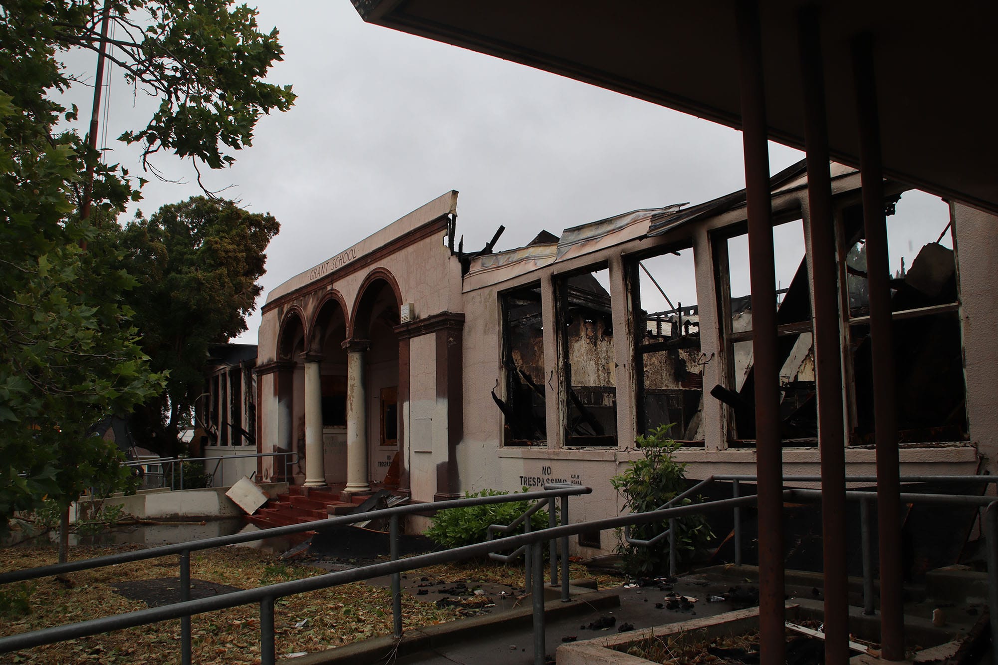Damage after firefighters put out a three-alarm blaze at the shuttered Grant School on Saturday morning.