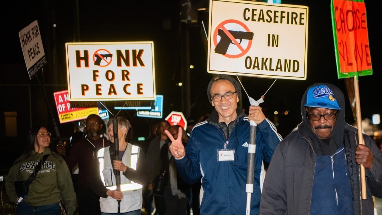 A community night walk in Oakland organized by Faith in Action Eastbay and community leaders.