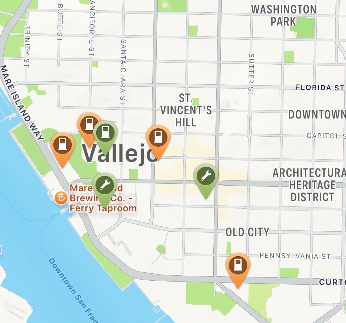 An app view shows inactive charging stations in orange in downtown Vallejo.