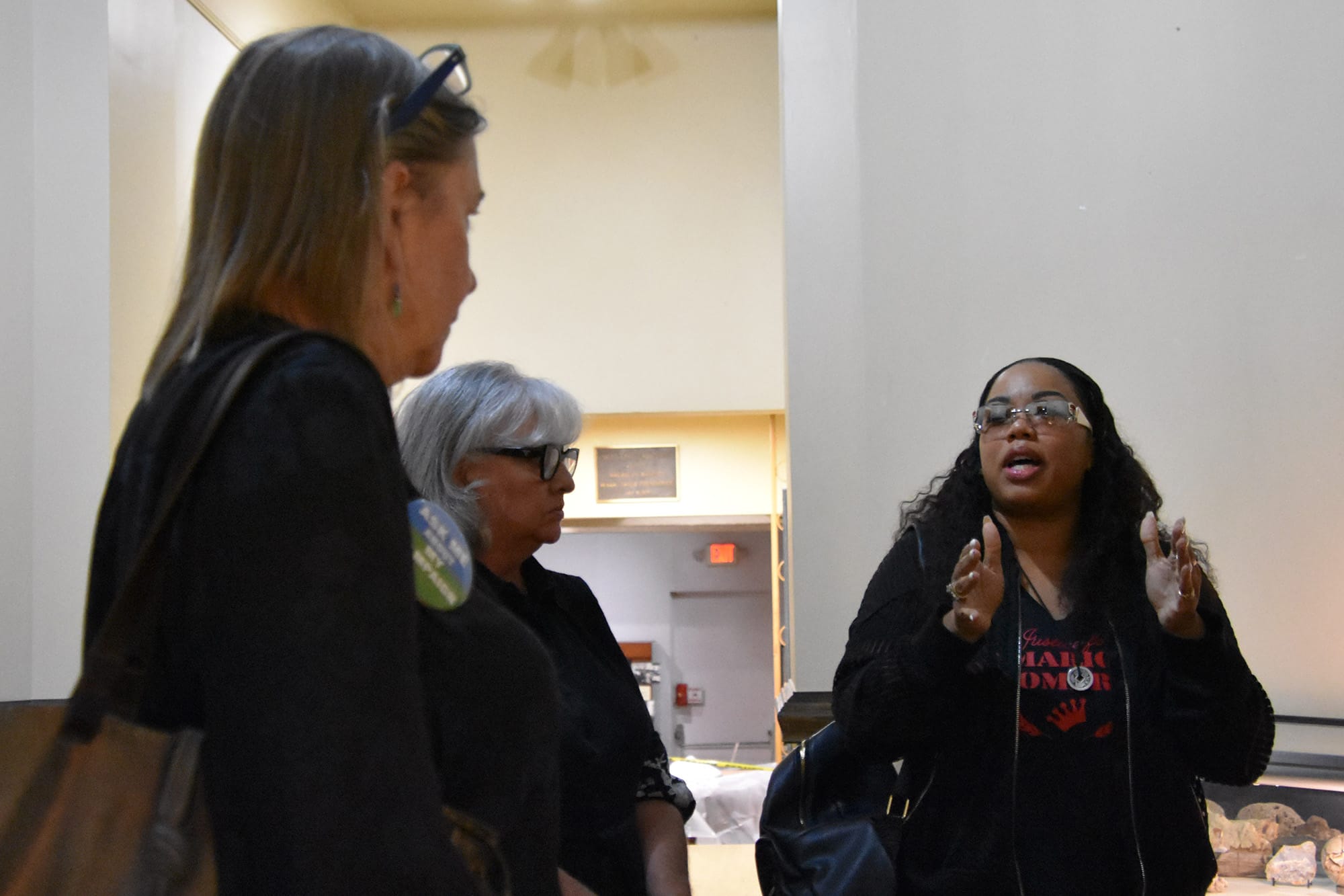  Kris Kelley, whose brother Mario Romero was shot and killed by Vallejo police officers in 2012, speaks outside of a town hall meeting Wednesday. 