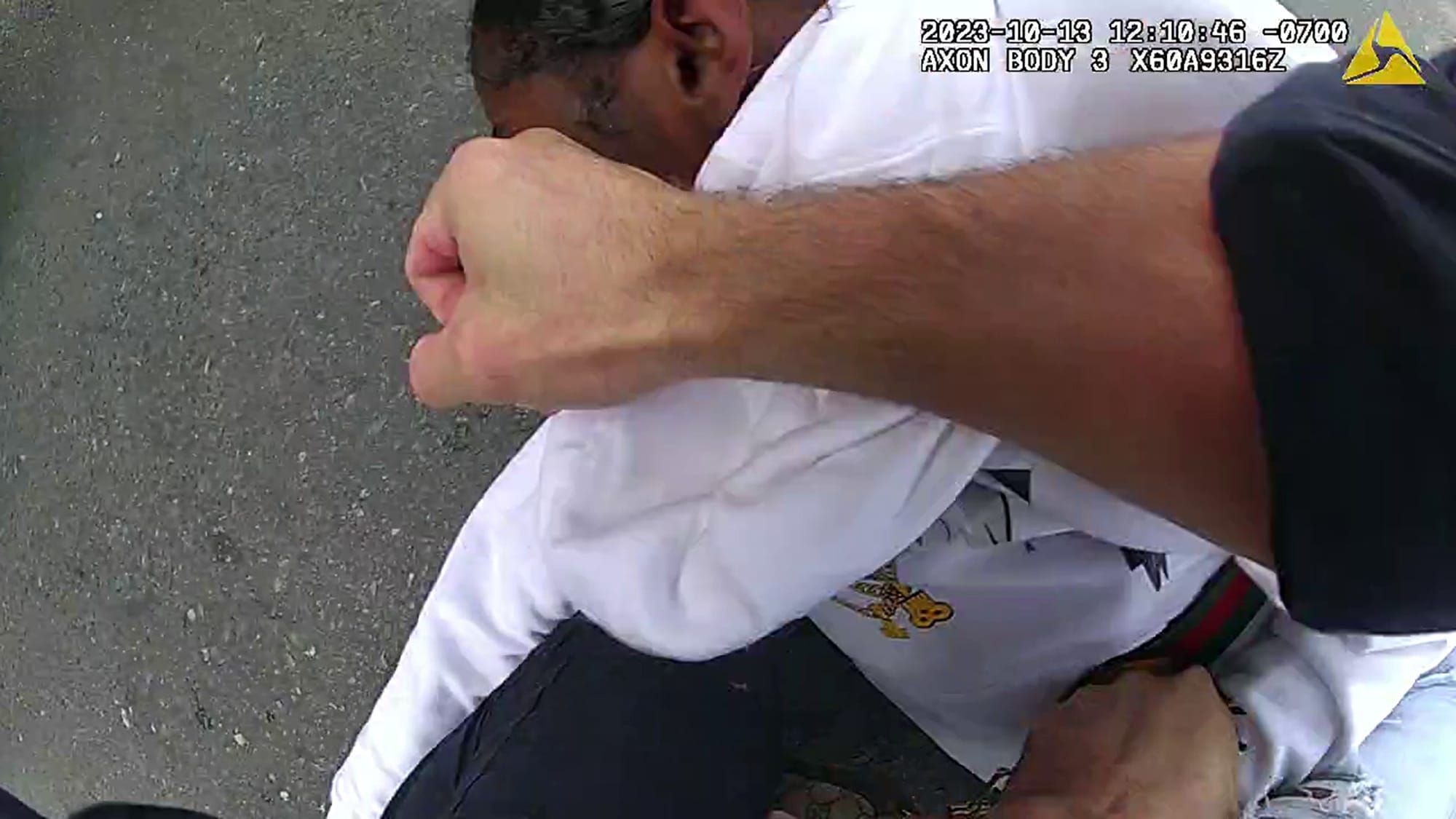Body camera footage shows Officer Colin Eaton punch Maiya Green on the ground after a pursuit in 2023.