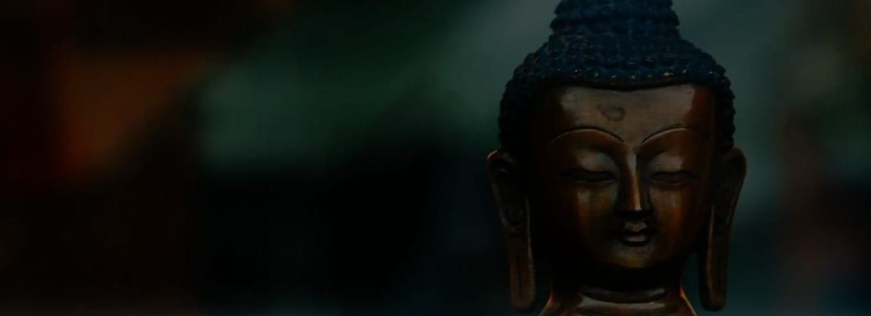 blue buddha figurine in tilt shift lens