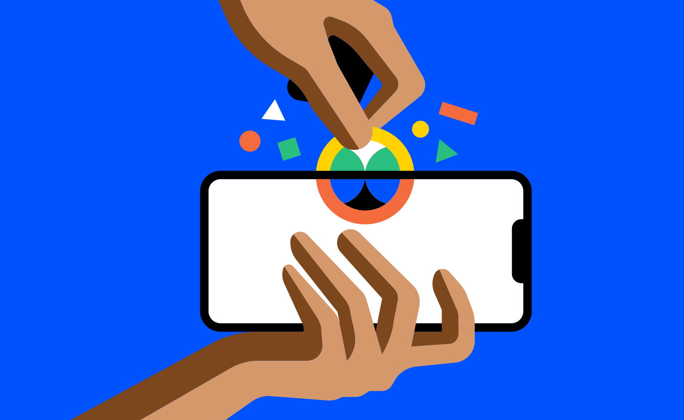 Manos toman un celular y moneda