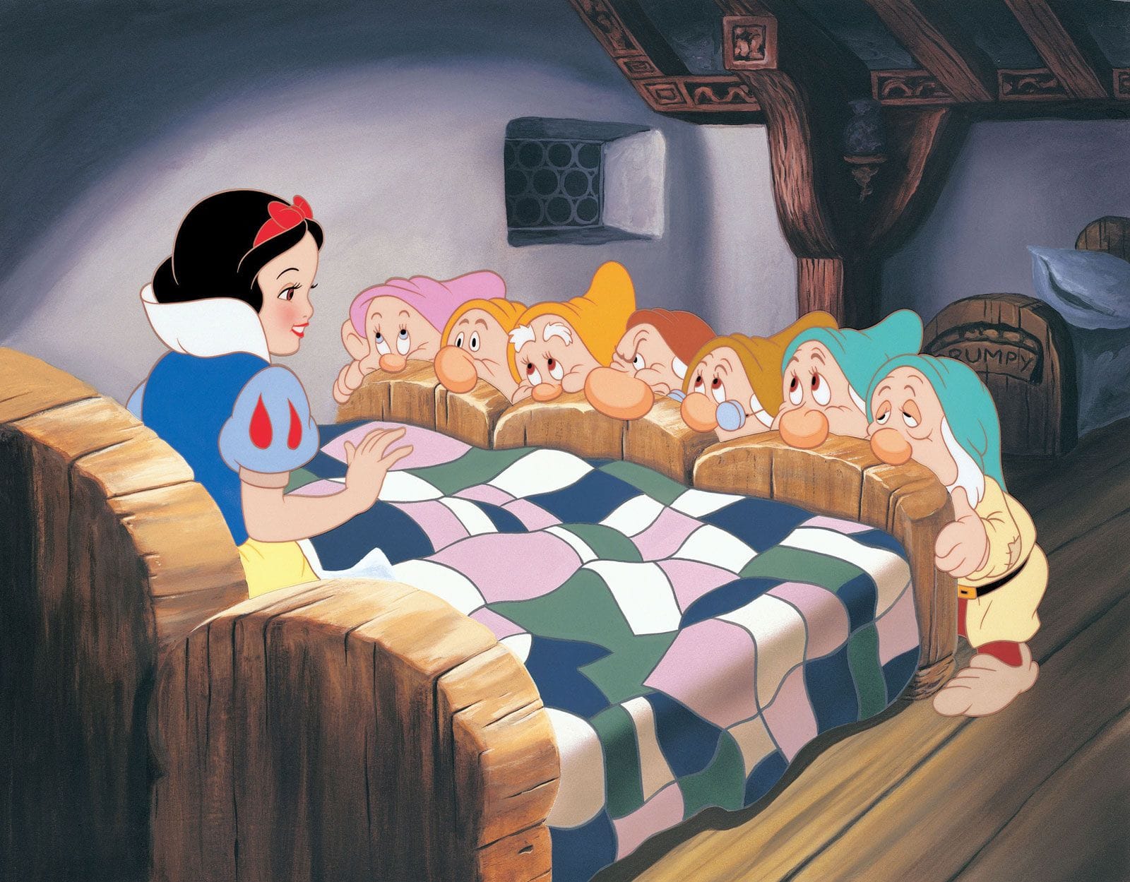 Snow White sits up in a three-in-one bed, while seven dwarfs, whose faces show different emotions, peer over the end of the bed.