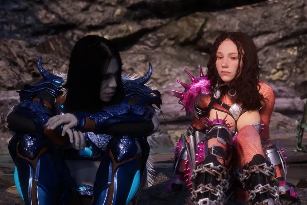A pale-skinned, dark-haired night in blue armor sits, hands crossed, next to a woman in fishnet armor with pink spiky armor, belts, and chains.