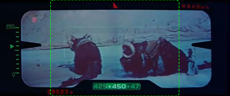 A 2.39:1 widescreen view through electronic binoculars of two large beasts of burden, with a humanoid figure to the right. In the center a green dotted line traces the frame of a 4:3 TV aspect ratio, which cuts out the figure.