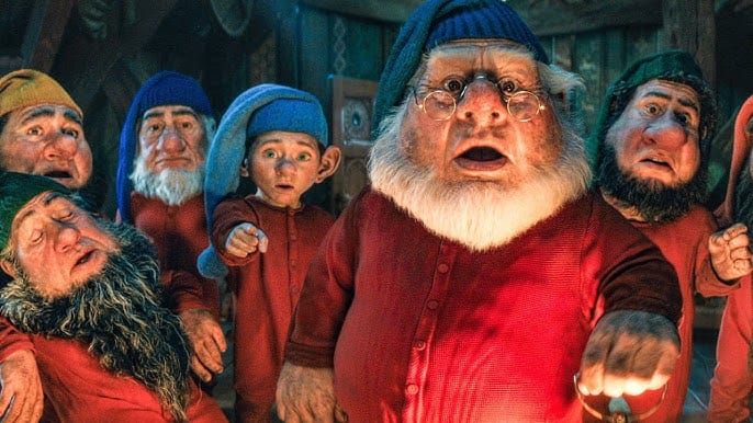 Seven fuck-ugly CGI dwarfs look shocked and terrified, with Dopey pointing directly at the camera.