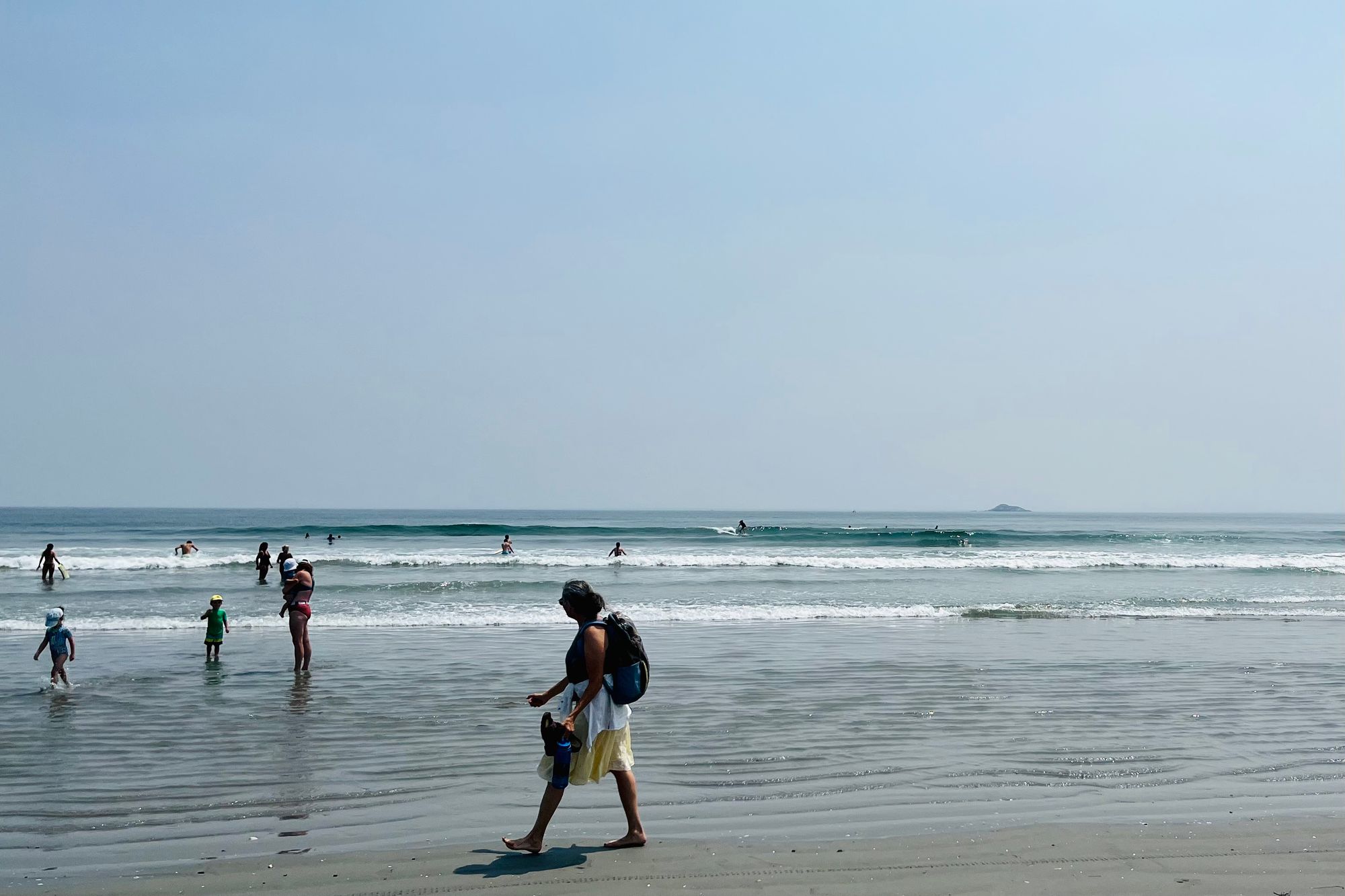 Catching waves between swimmers in Nahant Beach