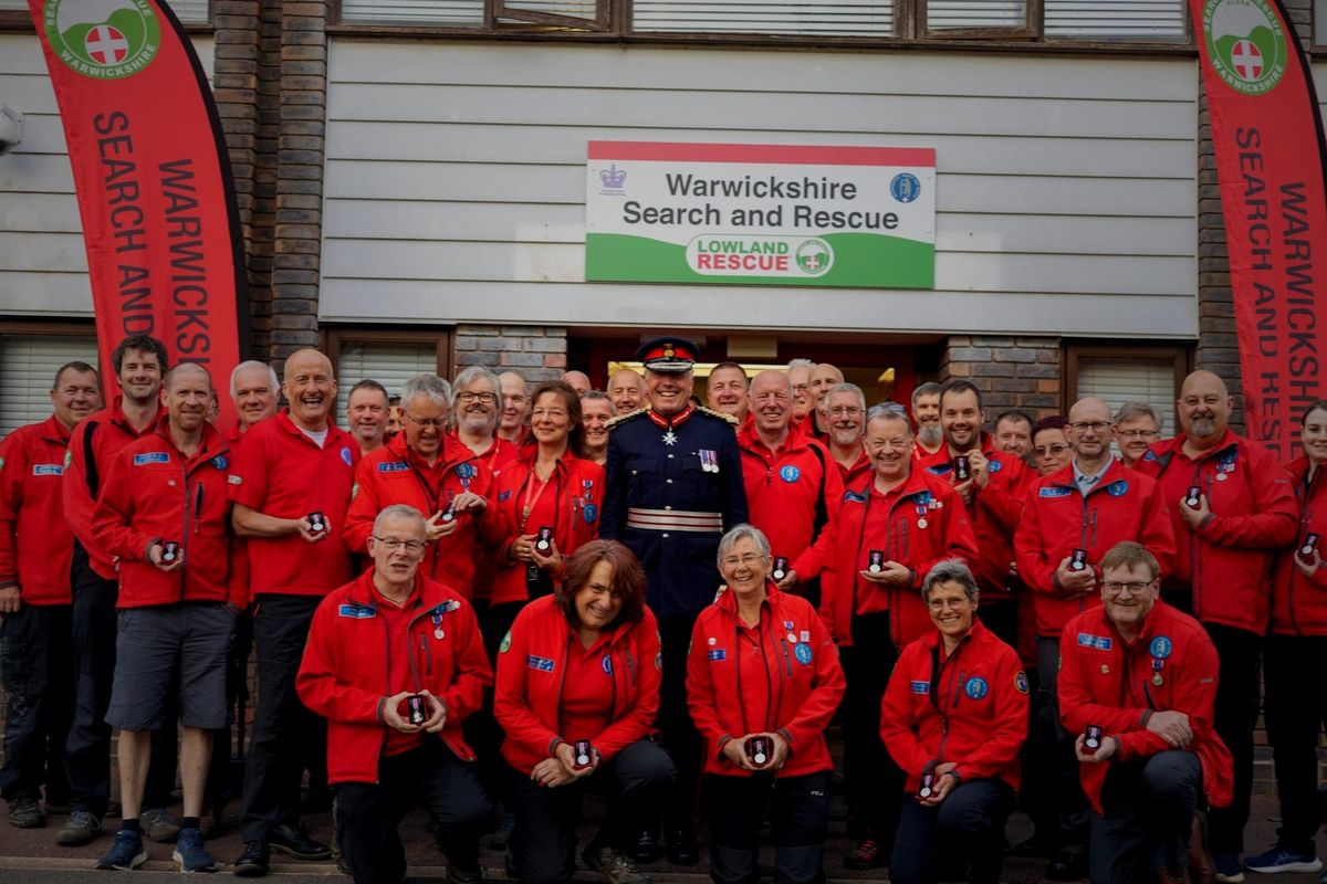 A Warwickshire Search and Rescue volunteer carrying out a land search
