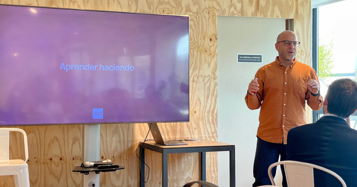 Marc Navarro presenting in front of coworking professionals