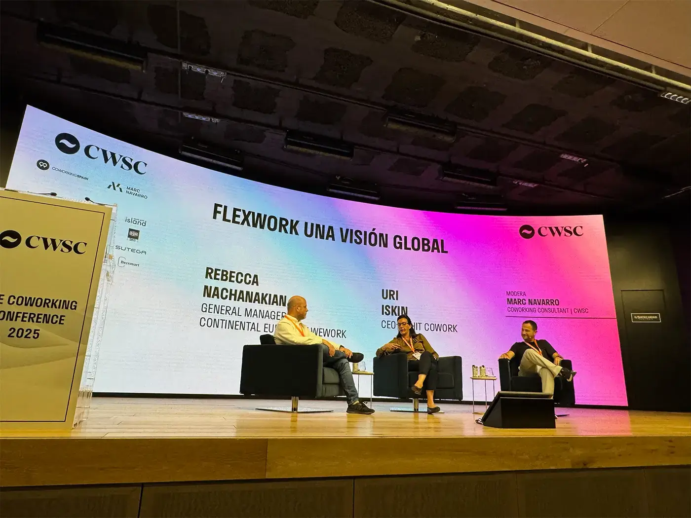 Uri Iskin and Rebecca Nachanakian at their "Flexwork: a Global Vision” talk, moderated by Marc Navarro at CWSC 2025.