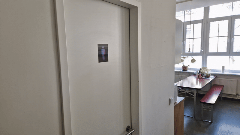 Gender-neutral bathroom signage.