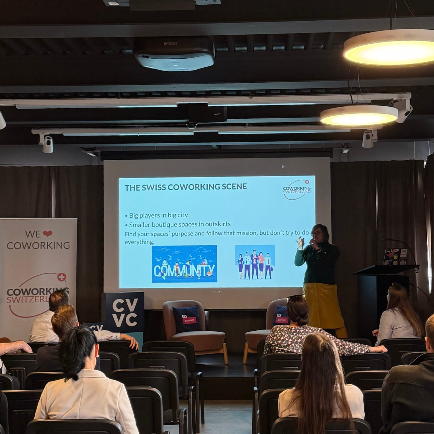 Mélanie presenting "The Swiss Coworking Scene" slide about big players, boutique spaces, and community at CV Labs.