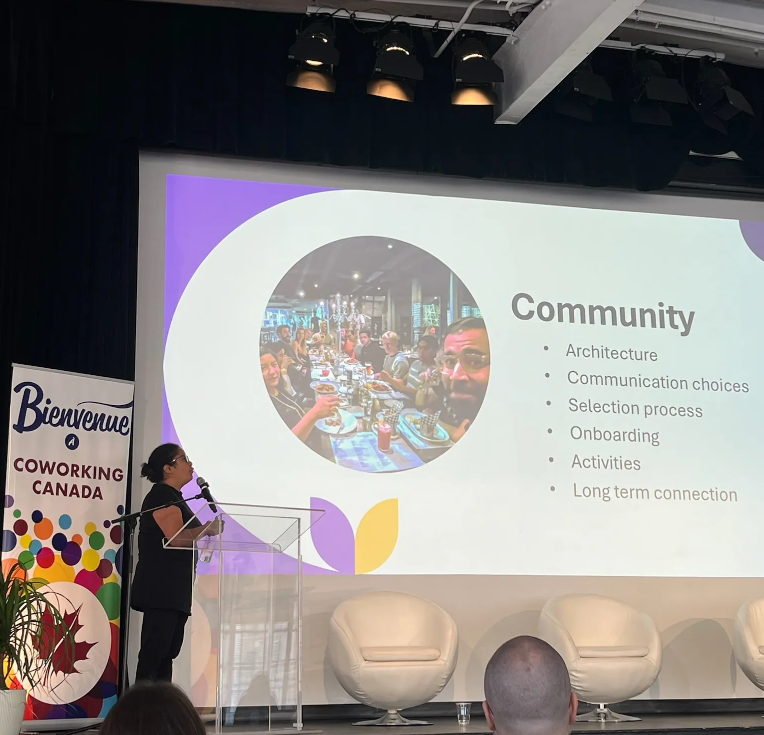 Maria Kinoshita presenting a slide with the title "Community" at Coworking Canada 2026.