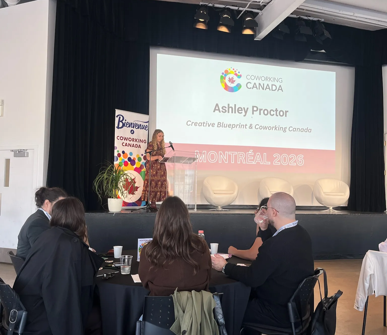 Ashley Proctor on the stage of Coworking Canada 2026.