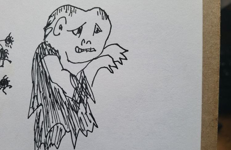 una persona vestida en ropa andrajosa y dedos como garras. a person in tattered clothes and fingers like claws.