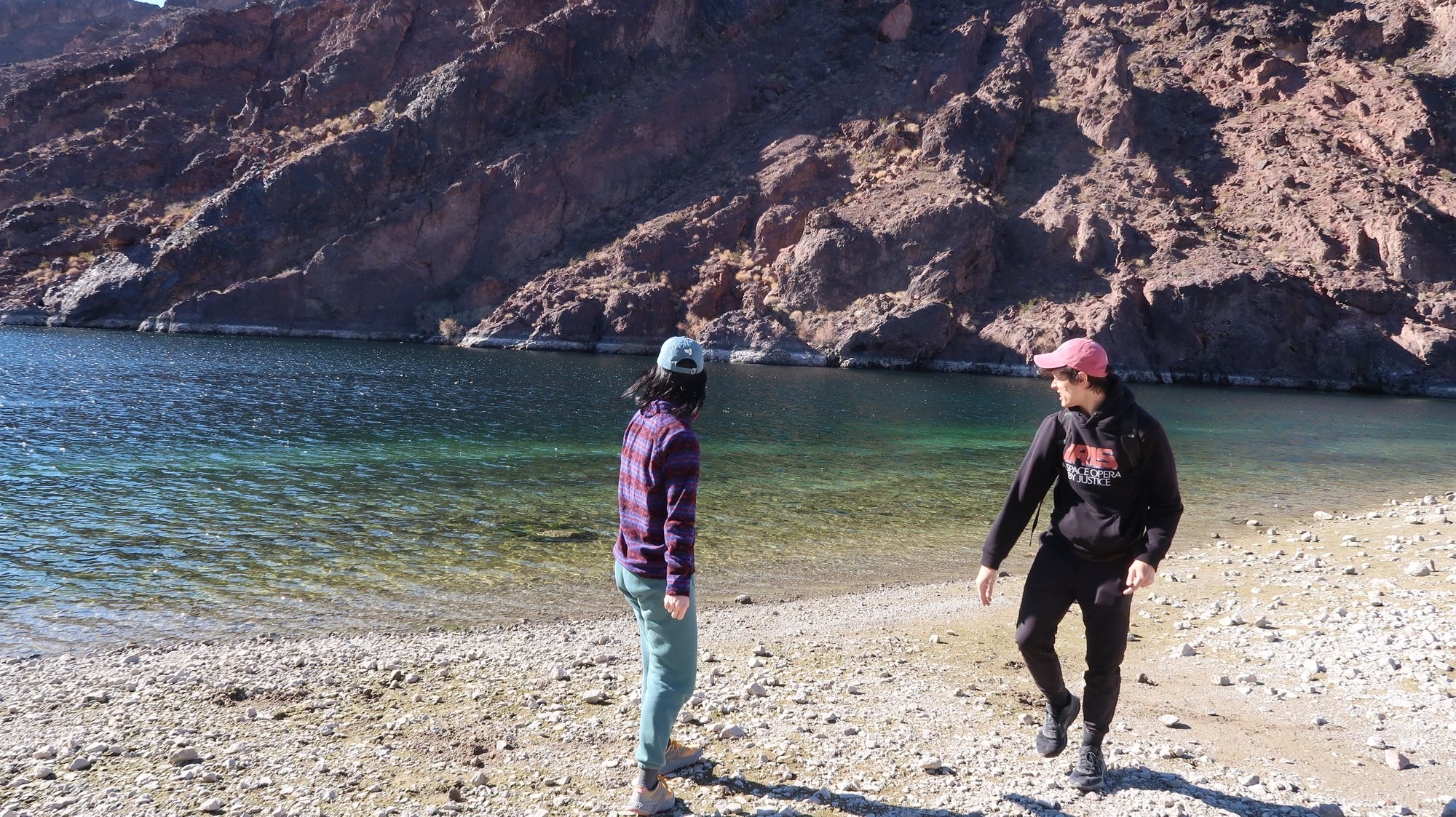 Ian and lacy skipping stones along the Colorado River