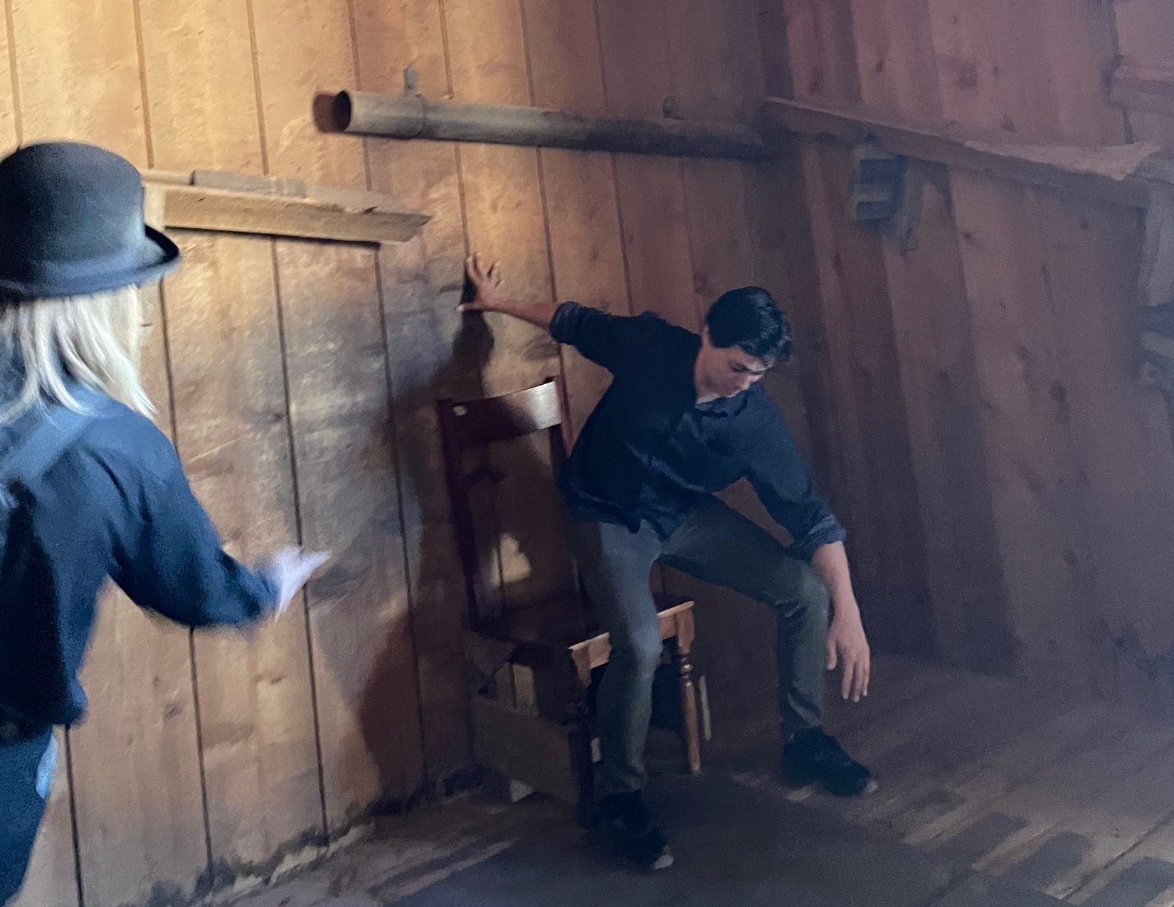 two people losing their balance in a gravity defying museum in Mesa, Arizona