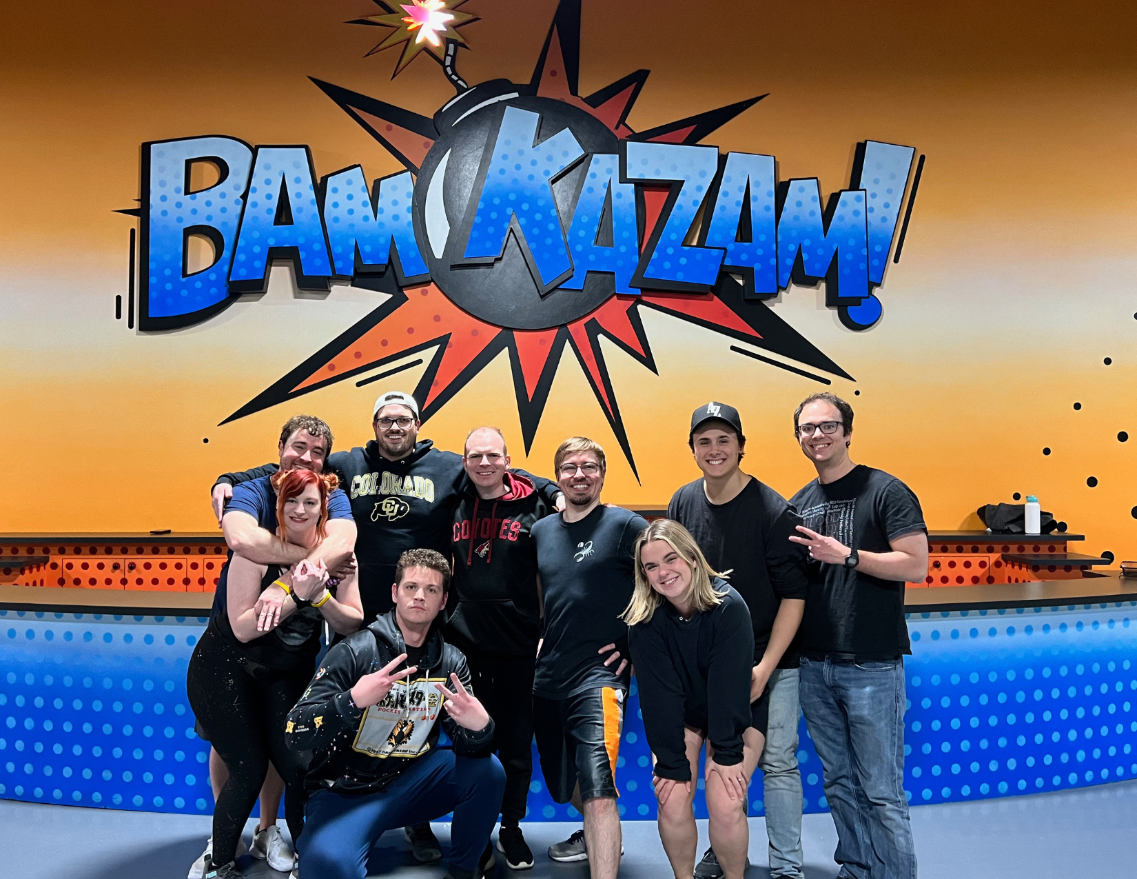 A new group of friends smiling after completing an escape room in Phoenix, Arizona